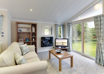 Park home living room with natural light.